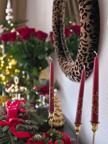 Close up of golden leopard print silk velvet mirror frame showing pattern detail