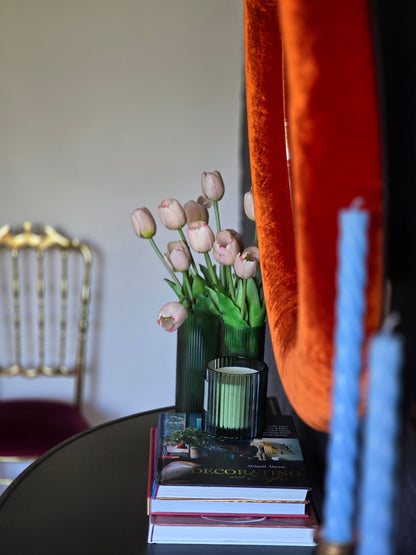 Close up of rust orange silk velvet mirror frame showing warm tone and directional sheen