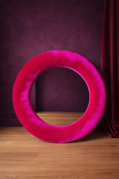 Close up of magenta pink silk velvet mirror frame showing vibrant colour and pile