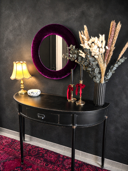 Deep purple velvet round wall mirror 60cm styled in maximalist interior with jewel tones