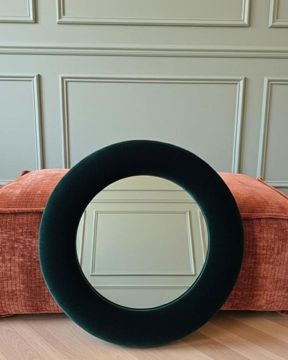 Close up of forest green silk velvet mirror frame showing rich texture and depth