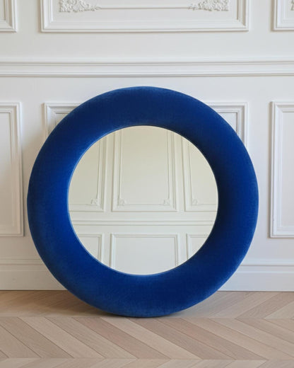 Close up of sapphire blue silk velvet mirror frame showing deep colour depth and pile