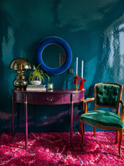 Sapphire blue velvet round wall mirror 60cm styled in dark dramatic interior with jewel tones