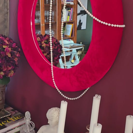 Close up of scarlet red silk velvet mirror frame showing vivid colour and directional pile