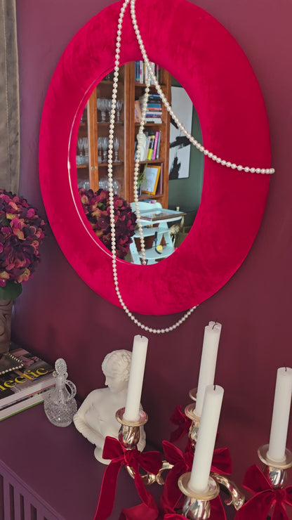 Close up of scarlet red silk velvet mirror frame showing vivid colour and directional pile